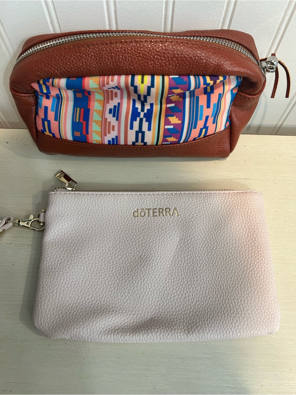 Pink Doterra zippered wallet and Aztec style bag